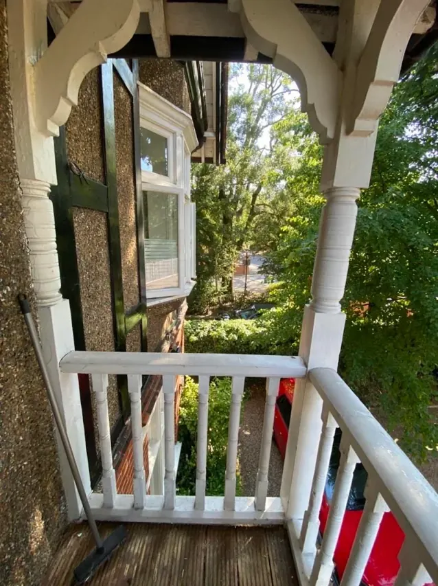 Painted timber veranda balustrade with ornate brackets